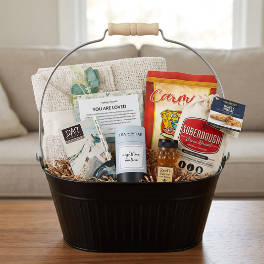 Sympathy gift arrangement in your black oval handled basket